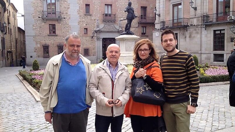 four tourists posing