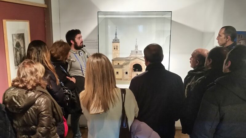 travel guide with group of tourists