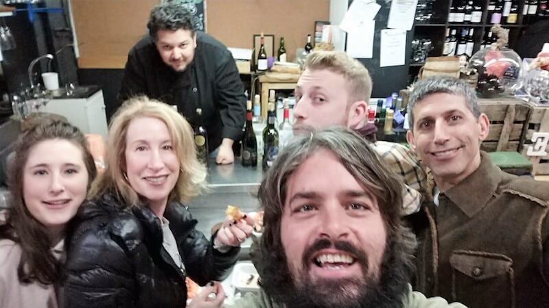 Group of people posing in a local Madrid food bar