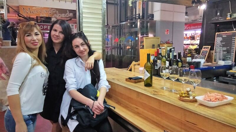 Three persons in Madrid food bar